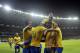 Brazil's Dani Alves, top, jumps on top of his teammates after teammate Gabriel Jesus scored their team's first goal against Argentina during a Copa America semifinal soccer match at Mineirao stadium in Belo Horizonte, Brazil, Tuesday, July 2, 2019. (AP Photo/Eugenio Savio)