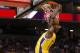 Los Angeles Lakers forward Devontae Cacok dunks as Golden State Warriors guard Ky Bowman watches during the first half of an NBA basketball summer league game in Sacramento, Calif., Tuesday, July 2, 2019. (AP Photo/Rich Pedroncelli)