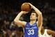 In this photo taken Monday July 1, 2019, Golden State Warriors guard Jimmer Fredette shoots a free throw during the first half of an NBA basketball summer league game against the Sacramento Kings in Sacramento, Calif. The Kings won 81-77. (AP Photo/Rich Pedroncelli)