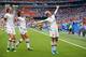 LYON, FRANCE - JULY 07: Megan Rapinoe of the USA celebrates with teammates Alex Morgan and Samantha Mewis after scoring her team's first goal during the 2019 FIFA Women's World Cup France Final match between The United States of America and The Netherlands at Stade de Lyon on July 07, 2019 in Lyon, France. (Photo by Richard Heathcote/Getty Images)