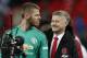Manchester United's Spanish goalkeeper David de Gea (L) jokes with Manchester United's Norwegian caretaker manager Ole Gunnar Solskjaer following the English Premier League football match between Tottenham Hotspur and Manchester United at Wembley Stadium in London, on January 13, 2019. - Manchester United won 1-0. (Photo by Adrian DENNIS / AFP) / RESTRICTED TO EDITORIAL USE. No use with unauthorized audio, video, data, fixture lists, club/league logos or 'live' services. Online in-match use limited to 120 images. An additional 40 images may be used in extra time. No video emulation. Social media in-match use limited to 120 images. An additional 40 images may be used in extra time. No use in betting publications, games or single club/league/player publications. / (Photo credit should read ADRIAN DENNIS/AFP/Getty Images)