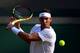 LONDON, ENGLAND - JULY 10: Rafael Nadal of Spain plays a backhand in his Men's Singles Quarter Final match against Sam Querrey of the United States during Day Nine of The Championships - Wimbledon 2019 at All England Lawn Tennis and Croquet Club on July 10, 2019 in London, England. (Photo by Laurence Griffiths/Getty Images)