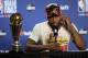 Toronto Raptors forward Kawhi Leonard speaks at a news conference alongside the NBA Finals Most Valuable Player trophy after the Raptors defeated the Golden State Warriors in Game 6 of basketball's NBA Finals in Oakland, Calif., Thursday, June 13, 2019. (AP Photo/Ben Margot)