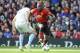 Manchester United's Romelu Lukaku vies for the ball with West Ham's Fabian Balbuena, left, during the English Premier League soccer match between Manchester United and West Ham United at Old Trafford in Manchester, England, Saturday, April 13, 2019. (AP Photo/Rui Vieira)