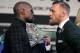Boxer Floyd Mayweather Jr. (L) and MMA figher Connor Mcgregor face-off during a media press conference August 23, 2017 at the MGM Grand in Las Vegas, Nevada.
Mayweather, the 40-year-old undefeated former welterweight boxing champion, has been lured out of retirement to face McGregor, a star of mixed martial arts' Ultimate Fighting Championship. The two men meet in a 12-round contest under boxing rules on August 26th that is tipped to become the richest fight in history.
/ AFP PHOTO / John Gurzinski (Photo credit should read JOHN GURZINSKI/AFP/Getty Images)