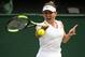 LONDON, ENGLAND - JULY 11: Simona Halep of Romania hits a forehand against Elina Svitolina of Ukraine during Day 10 of The Championships - Wimbledon 2019 at All England Lawn Tennis and Croquet Club on July 11, 2019 in London, England. (Photo by TPN/Getty Images)