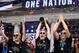 TOPSHOT - USA women's soccer player Lindsey Horan, Megan Rapinoe (C), Alexandra Long(R) and other team members celebrate with the trophy in front of the City Hall after the ticker tape parade for the women's World Cup champions on July 10, 2019 in New York. - Tens of thousands of fans are poised to pack the streets of New York on Wednesday to salute the World Cup-winning US women's team in a ticker-tape parade. Four years after roaring fans lined the route of Lower Manhattan's fabled