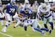 New York Giants' Saquon Barkley, top, is hit by Dallas Cowboys' Anthony Brown during the first half of an NFL football game, Sunday, Dec. 30, 2018, in East Rutherford, N.J. (AP Photo/Frank Franklin II)