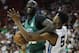 Boston Celtics' Tacko Fall drives into Memphis Grizzlies' Bruno Caboclo during the first half of an NBA summer league basketball game Thursday, July 11, 2019, in Las Vegas. (AP Photo/John Locher)