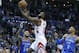 Houston Rockets guard James Harden, center, shoots between Oklahoma City Thunder guard Josh Huestis (34) and guard Russell Westbrook (0) in the first half of an NBA basketball game in Oklahoma City, Tuesday, March 6, 2018. (AP Photo/Sue Ogrocki)