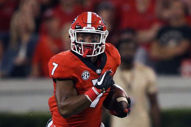 FILE - In this Oct. 14, 2017, file photo, Georgia running back D'Andre Swift (7) runs against Missouri in the second half of an NCAA college football game in Athens, Ga. While playing behind seniors Nick Chubb and Sony Michel, Swift was Georgia’s third-leading rusher with 618 yards and fourth on the team with 17 catches (more than Chubb and Michel combined) for 153 yards. (AP Photo/John Bazemore, File)