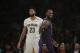 LeBron James of the Los Angeles Lakers, right, smiles past Anthony Davis of the New Orleans Pelicans in the first half of an NBA basketball game on Friday, December 21, 2018 in Los Angeles . (AP Photo / Jae C. Hong)