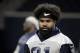 FILE - In this May 22, 2019 file photo Dallas Cowboys running back Ezekiel Elliott (21) walks off the field after NFL football practice in Frisco, Texas. Elliott is vowing to avoid incidents similar to a recent one in Las Vegas that forced the star running back to meet with Commissioner Roger Goodell. Elliott tweeted Tuesday, July 2, 2019 after meeting with Goodell in New York that he had “worked hard to make better decisions” but “failed to do that” during a music festival in May at Las Vegas Motor Speedway. (AP Photo/Michael Ainsworth, file)