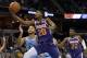 Phoenix Suns forward Josh Jackson (20) shoots against Memphis Grizzlies forward Kyle Anderson (1) in the first half of an NBA basketball game Saturday, Oct. 27, 2018, in Memphis, Tenn. (AP Photo/Brandon Dill)