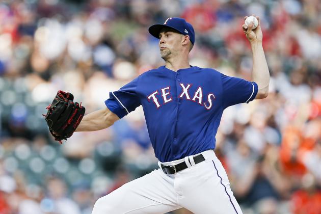 Texas Rangers starting pitcher Mike Minor throws during the first inning of a baseball game against the Houston Astros, Saturday, July 13, 2019, in Arlington, Texas. (AP Photo/Brandon Wade)
