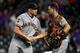 DENVER, CO - JULY 16: Mark Melancon #41 and Buster Posey #28 of the San Francisco Giants celebrate an 8-4 win in 10 innings over the Colorado Rockies at Coors Field on July 16, 2019 in Denver, Colorado. (Photo by Dustin Bradford/Getty Images)