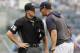 New York Yankees' Aaron Boone, right, gets in the face of home plate umpire Brennan Miller during the second inning of game one of a baseball doubleheader against the Tampa Bay Rays, Tuesday, July 16, 2019, in New York. Boone had already been ejected when he expressed his displeasure with the umpire's calls. (AP Photo/Kathy Willens)