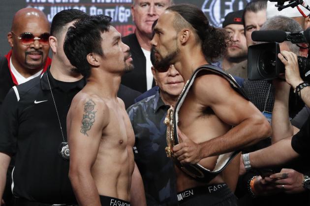 Manny Pacquiao, front left, and Keith Thurman pose during a weigh-in Friday, July 19, 2019, in Las Vegas. They are scheduled to fight in a welterweight championship boxing match Saturday in Las Vegas. (AP Photo/John Locher)