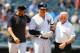 NEW YORK, NEW YORK - JULY 20: Aaron Boone #17 of the New York Yankees attends to Luke Voit #45 after being hit by a pitch in the fourth inning against the Colorado Rockies at Yankee Stadium on July 20, 2019 in New York City. (Photo by Mike Stobe/Getty Images)