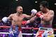 Filipino boxer Manny Pacquiao (R) and US boxer Keith Thurman during their WBA super world welterweight title fight at the MGM Grand Garden Arena on July 20, 2019 in Las Vegas, Nevada. - Pacquiao won a 12 round split decision. (Photo by John Gurzinski / AFP) (Photo credit should read JOHN GURZINSKI/AFP/Getty Images)