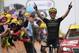 TOPSHOT - Great Britain's Simon Yates celebrates as he wins on the finish line of the fifteen stage of the 106th edition of the Tour de France cycling race between Limoux and Foix Prat d'Albis, in Foix Prat d'Albis on July 21, 2019. (Photo by JEFF PACHOUD / AFP) (Photo credit should read JEFF PACHOUD/AFP/Getty Images)