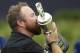 Ireland's Shane Lowry holds and kisses the Claret Jug trophy after winning the British Open Golf Championships at Royal Portrush in Northern Ireland, Sunday, July 21, 2019.(AP Photo/Peter Morrison)