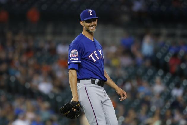 Texas Rangers pitcher Mike Minor smiles after the final out in the ninth inning of a baseball game against the Detroit Tigers in Detroit, Wednesday, June 26, 2019. Texas won 4-1. (AP Photo/Paul Sancya)