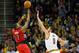 CLEVELAND, OH - NOVEMBER 22: Kyle Lowry #7 of the Toronto Raptors shoots over Kevin Love #0 of the Cleveland Cavaliers during the second half at Quicken Loans Arena on November 22, 2014 in Cleveland, Ohio. The Raptors defeated the Cavaliers 110-93. NOTE TO USER: User expressly acknowledges and agrees that, by downloading and or using this photograph, User is consenting to the terms and conditions of the Getty Images License Agreement. (Photo by Jason Miller/Getty Images)