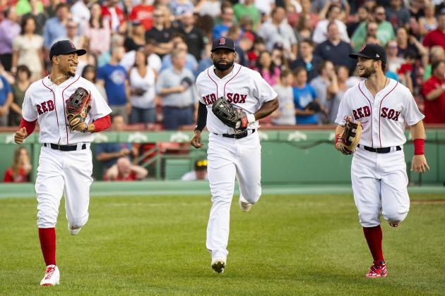 BOSTON, MA - JULY 16: Mookie Betts #50, Jackie Bradley Jr. #19, and Andrew Benintendi #16 of the Boston Red Sox run onto the field before a game against the Toronto Blue Jays on July 16, 2019 at Fenway Park in Boston, Massachusetts. (Photo by Billie Weiss/Boston Red Sox/Getty Images)