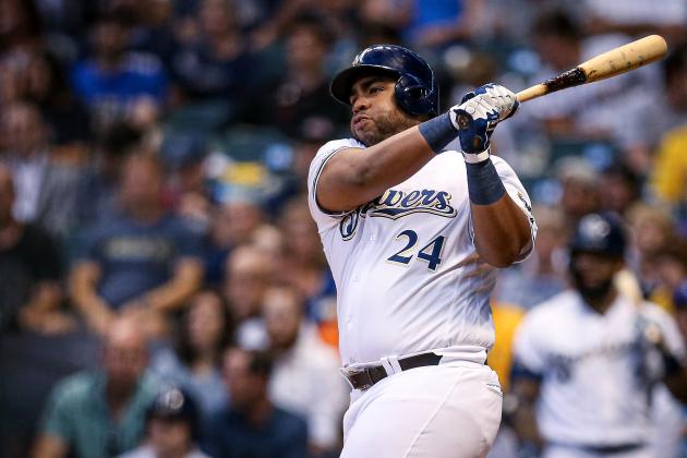 MILWAUKEE, WISCONSIN - JULY 22:  Jesus Aguilar #24 of the Milwaukee Brewers hits a double in the fourth inning against the Cincinnati Reds at Miller Park on July 22, 2019 in Milwaukee, Wisconsin. (Photo by Dylan Buell/Getty Images)
