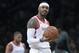 FILE - In this Nov. 2, 2018, file photo, Houston Rockets forward Carmelo Anthony reacts during the second half of the team's NBA basketball game against the Brooklyn Nets in New York. The Rockets won 119-111. The addition of Anthony to the Rockets’ roster produced more thorns than fruit and now he is out. (AP Photo/Mary Altaffer, File)