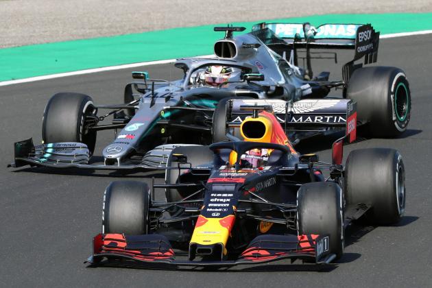 Red Bull's Dutch driver Max Verstappen (R) competes next to Mercedes' British driver Lewis Hamilton during the Formula One Hungarian Grand Prix at the Hungaroring circuit in Mogyorod near Budapest, Hungary, on August 4, 2019. (Photo by FERENC ISZA / AFP)        (Photo credit should read FERENC ISZA/AFP/Getty Images)