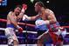 Keith Thurman, right, throws a punch against Manny Pacquiao in the eighth round during a welterweight title fight Saturday, July 20, 2019, in Las Vegas. (AP Photo/John Locher)