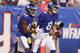 New York Giants quarterback Daniel Jones (8) celebrates with Bennie Fowler (18) after they connected for a touchdown during the first half of a preseason NFL football game against the New York Jets on Thursday, Aug. 8, 2019, in East Rutherford, N.J. (AP Photo/Michael Owens)
