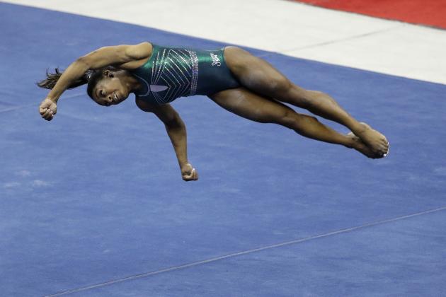 Simone Biles works on her floor exercise during practice for the senior women's competition at the 2019 U.S. Gymnastics Championships Friday, Aug. 9, 2019, in Kansas City, Mo. (AP Photo/Charlie Riedel)