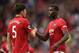 Manchester United's English defender Harry Maguire (L) shakes hands with Manchester United's French midfielder Paul Pogba (R) on the pitch at the final whistle in the English Premier League football match between Manchester United and Chelsea at Old Trafford in Manchester, north west England, on August 11, 2019. - Manchester United won the game 4-0. (Photo by Oli SCARFF / AFP) / RESTRICTED TO EDITORIAL USE. No use with unauthorized audio, video, data, fixture lists, club/league logos or 'live' services. Online in-match use limited to 120 images. An additional 40 images may be used in extra time. No video emulation. Social media in-match use limited to 120 images. An additional 40 images may be used in extra time. No use in betting publications, games or single club/league/player publications. / (Photo credit should read OLI SCARFF/AFP/Getty Images)