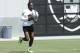 Oakland Raiders wide receiver Antonio Brown warms up during an official team activity at the NFL football team's headquarters in Alameda, Calif., Tuesday, May 28, 2019. (AP Photo/Jeff Chiu)