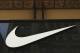 FILE - In this Thursday, June 15, 2017, file photo, the Nike logo adorns the Nike SoHo store, in the SoHo neighborhood of New York. Nike, Inc. reports earnings, Thursday, June 29, 2017. (AP Photo/Michael Noble Jr., File)