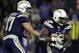 Los Angeles Chargers running back Melvin Gordon (28) gets a hand off from quarterback Philip Rivers from during an NFL football game against the Baltimore Ravens Saturday, Dec. 22, 2018, in Carson, Calif. (AP Photo/Marcio Jose Sanchez)
