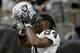 Oakland Raiders wide receiver Antonio Brown (84) puts on his helmet prior to an NFL football game against the Arizona Cardinals, Thursday, Aug. 15, 2019, in Glendale, Ariz. (AP Photo/Rick Scuteri)