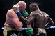 LOS ANGELES, CA - DECEMBER 01: Deontay Wilder and Tyson Fury punch each other in the ninth round fighting to a draw during the WBC Heavyweight Championship at Staples Center on December 1, 2018 in Los Angeles, California. (Photo by Harry How/Getty Images)
