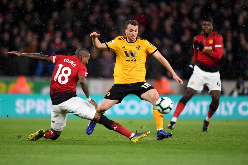 WOLVERHAMPTON, ENGLAND - APRIL 02: Ashley Young of Manchester United and Diogo Jota of Wolverhampton Wanderers during the Premier League match between Wolverhampton Wanderers and Manchester United at Molineux on April 2, 2019 in Wolverhampton, United Kingdom. (Photo by Sam Bagnall - AMA/Getty Images)