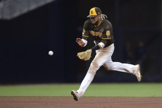 San Diego Padres shortstop Fernando Tatis Jr. fields a ground ball during the ninth inning of the baseball game against the Colorado Rockies Friday, Aug. 9, 2019, in San Diego. The Padres won 7-1. (AP Photo/Orlando Ramirez)
