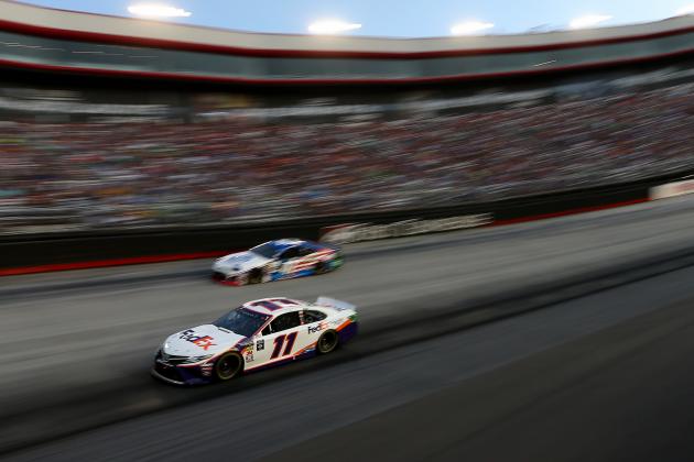 BRISTOL, TENNESSEE - AUGUST 17: Denny Hamlin, driver of the #11 FedEx Freight Toyota, leads a pack of cars during the Monster Energy NASCAR Cup Series Bass Pro Shops NRA Night Race at Bristol Motor Speedway on August 17, 2019 in Bristol, Tennessee. (Photo by Brian Lawdermilk/Getty Images)
