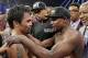 FILE - This May 2, 2015 file photo shows Manny Pacquiao from the Philippines, left, and Floyd Mayweather Jr., embracing in the ring at the finish of their welterweight title fight in Las Vegas. A federal judge Friday, Aug. 25, 2017 dismissed class-action lawsuits by disgruntled boxing fans around the country who complained they didn't get their pay-per-view money's worth in the fight. The judge said that he felt sympathy for fans who felt deceived that Pacquiao's camp failed to disclose he had a shoulder injury until about three hours before the fight. (AP Photo/Isaac Brekken,File)