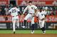 NEW YORK, NEW YORK - AUGUST 16: Aaron Judge #99, Gleyber Torres #25 and Didi Gregorius #18 of the New York Yankees celebrate after defeating the Cleveland Indians 3-2 at Yankee Stadium on August 16, 2019 in New York City. (Photo by Mike Stobe/Getty Images)