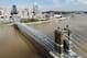 The Cincinnati skyline and John A. Roebling Suspension Bridge is seen from the banks of the Ohio River, Tuesday, Sept. 18, 2018, in Covington, Ky. (AP Photo/John Minchillo)