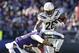 Los Angeles Chargers running back Melvin Gordon (28) leaps to avoid Baltimore Ravens cornerback Jimmy Smith (22) in the first half of an NFL wild card playoff football game, Sunday, Jan. 6, 2019, in Baltimore. (AP Photo/Carolyn Kaster)