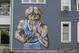 A mural of former NBA star Larry Bird is seen on the side of a multi-family residence in Fountain Square, Wednesday, Aug. 21, 2019, in Indianapolis. Larry Bird likes the mural but not the tatts. Bird's attorney, Gary Sallee, says the former Indiana Pacers executive