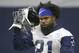Dallas Cowboys running back Ezekiel Elliott (21) walks the field during an organized team activity at its NFL football training facility in Frisco, Texas, Wednesday, May 29, 2019. (AP Photo/Ron Jenkins)